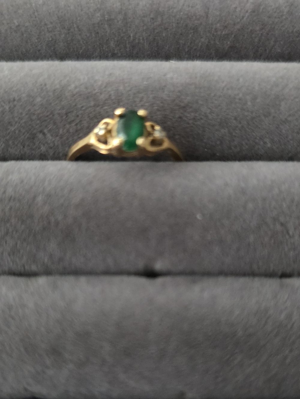 Gold Ring with Green Stone and Accent Details